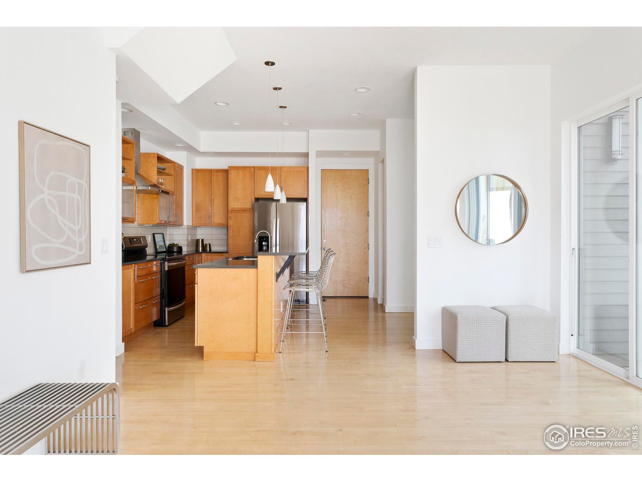 5247 5th Street Boulder, CO 80304 - Photo 5 of 34 a kitchen with a refrigerator a sink dishwasher with a dining table and chairs