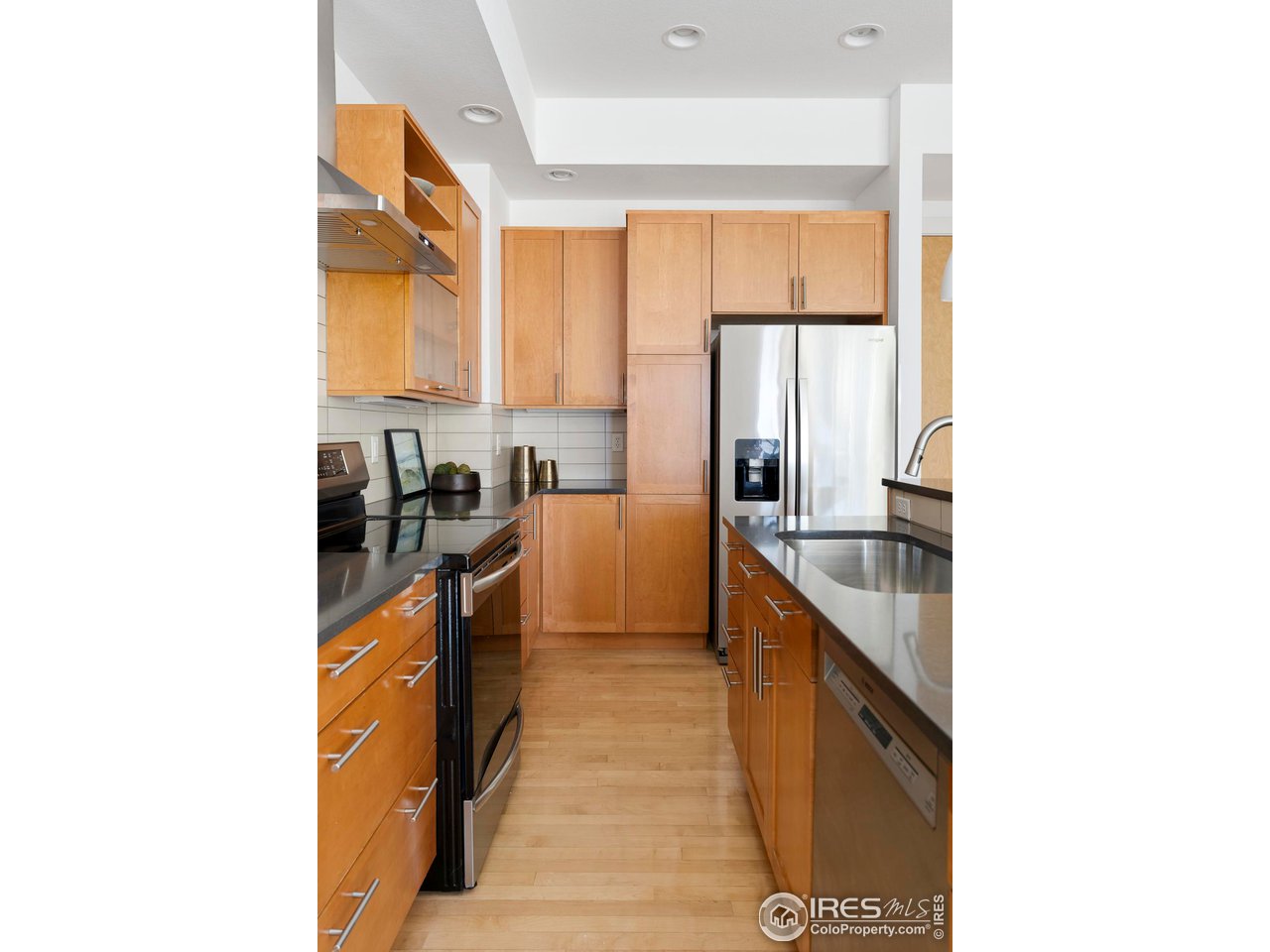 5247 5th Street Boulder, CO 80304 - Photo 7 of 34 a kitchen with granite countertop a sink and a stove