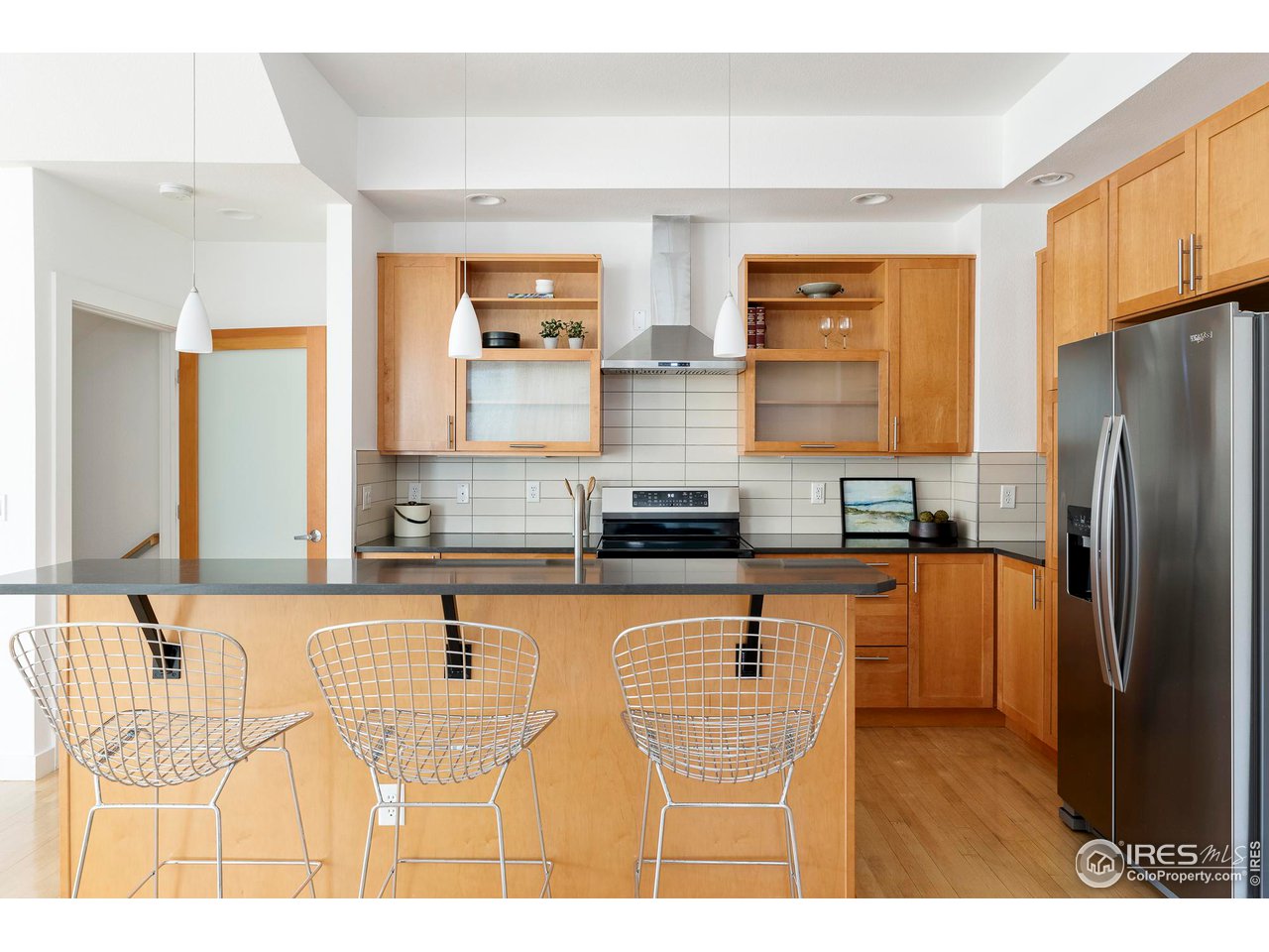 5247 5th Street Boulder, CO 80304 - Photo 8 of 34 a kitchen with stainless steel appliances granite countertop a sink refrigerator and microwave
