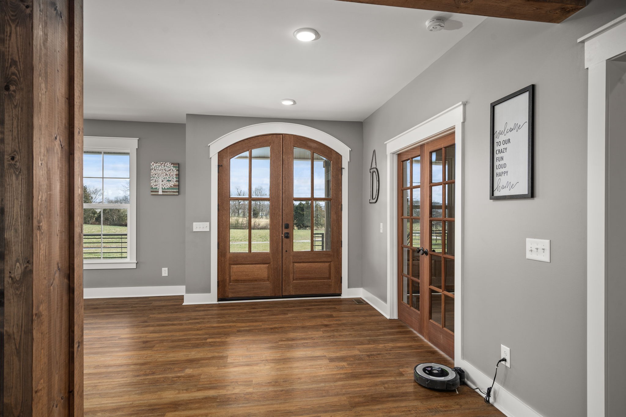 1155 Maxwell Branch Road Cottontown, TN 37048 - Photo 14 of 69 a view of an empty room with wooden floor and a window