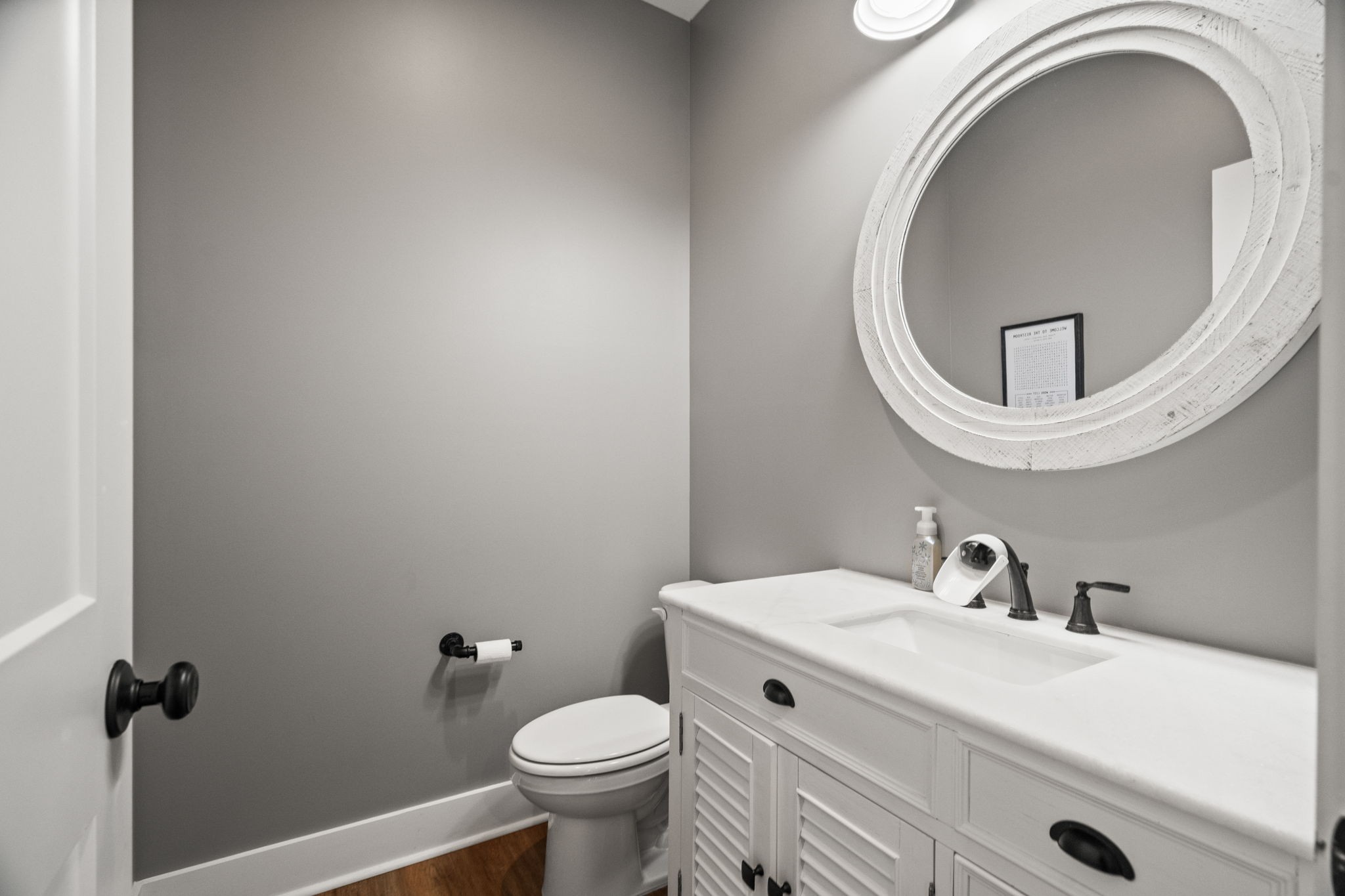 1155 Maxwell Branch Road Cottontown, TN 37048 - Photo 16 of 69 a bathroom with a sink mirror and toilet