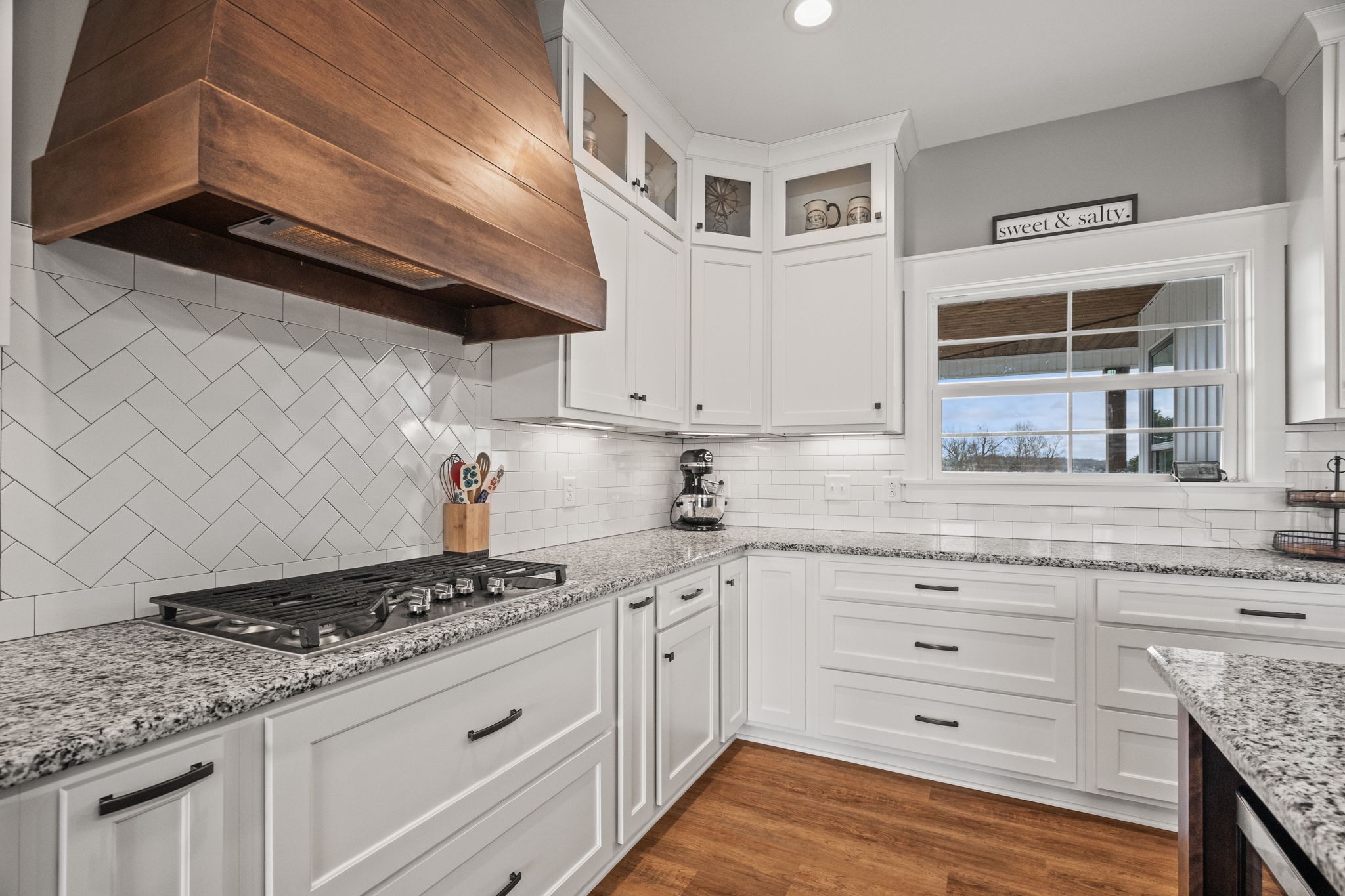 1155 Maxwell Branch Road Cottontown, TN 37048 - Photo 29 of 69 a kitchen with granite countertop stainless steel appliances cabinets and a counter top space