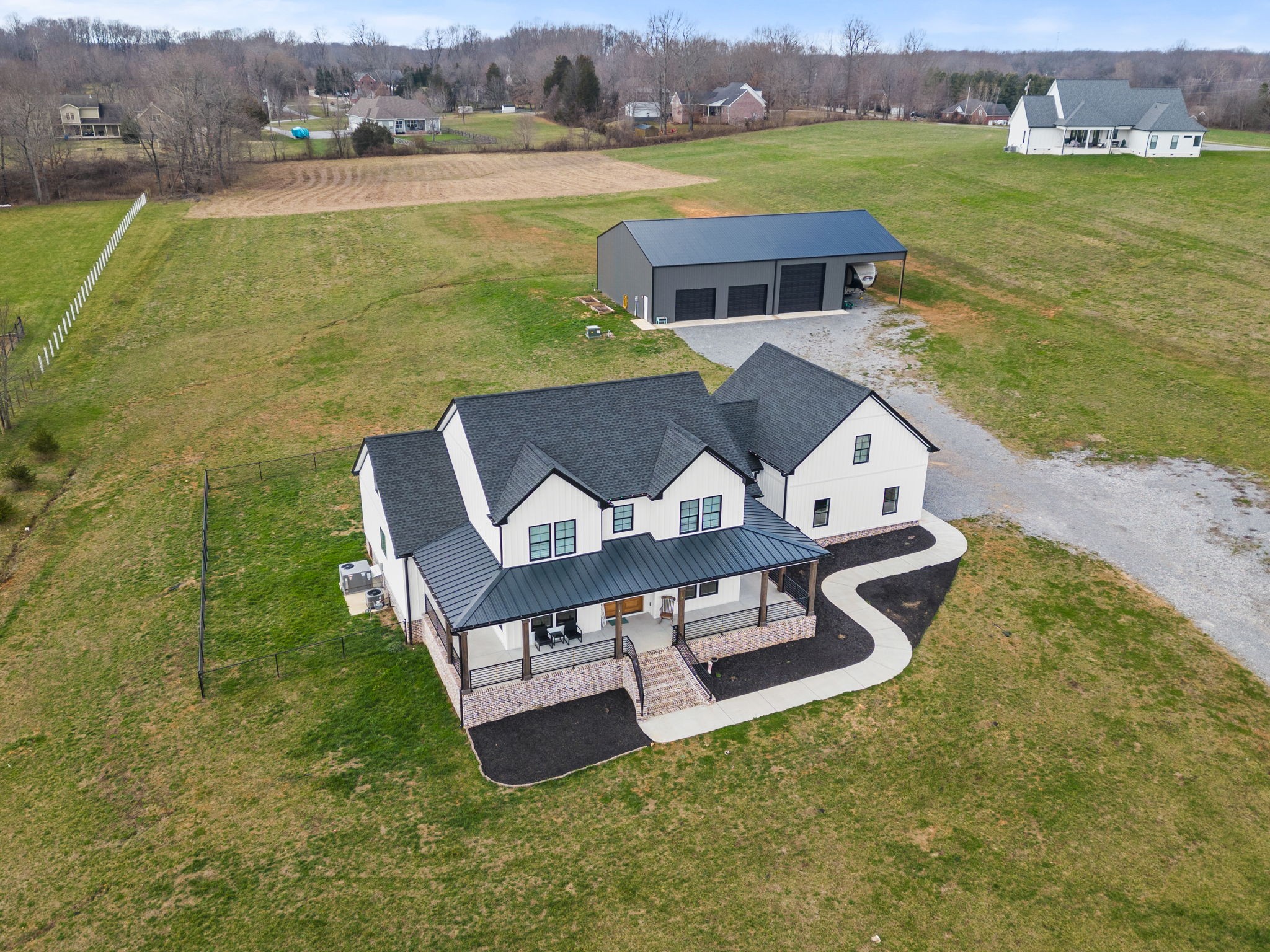 1155 Maxwell Branch Road Cottontown, TN 37048 - Photo 4 of 69 an aerial view of a house with garden space and ocean view