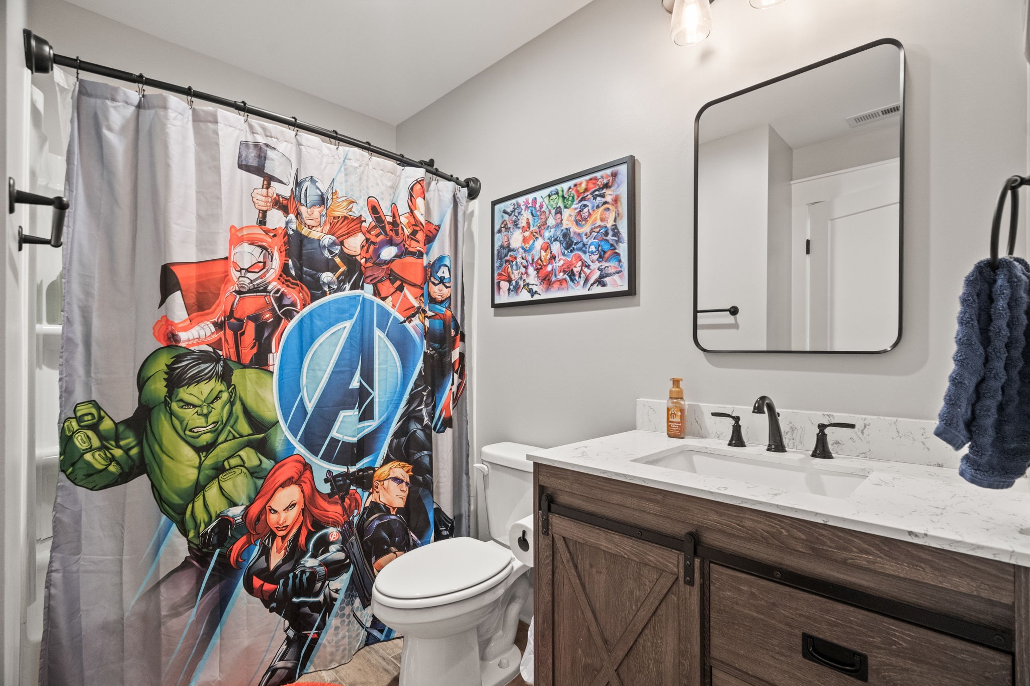 1155 Maxwell Branch Road Cottontown, TN 37048 - Photo 47 of 69 a bathroom with a toilet sink and mirror