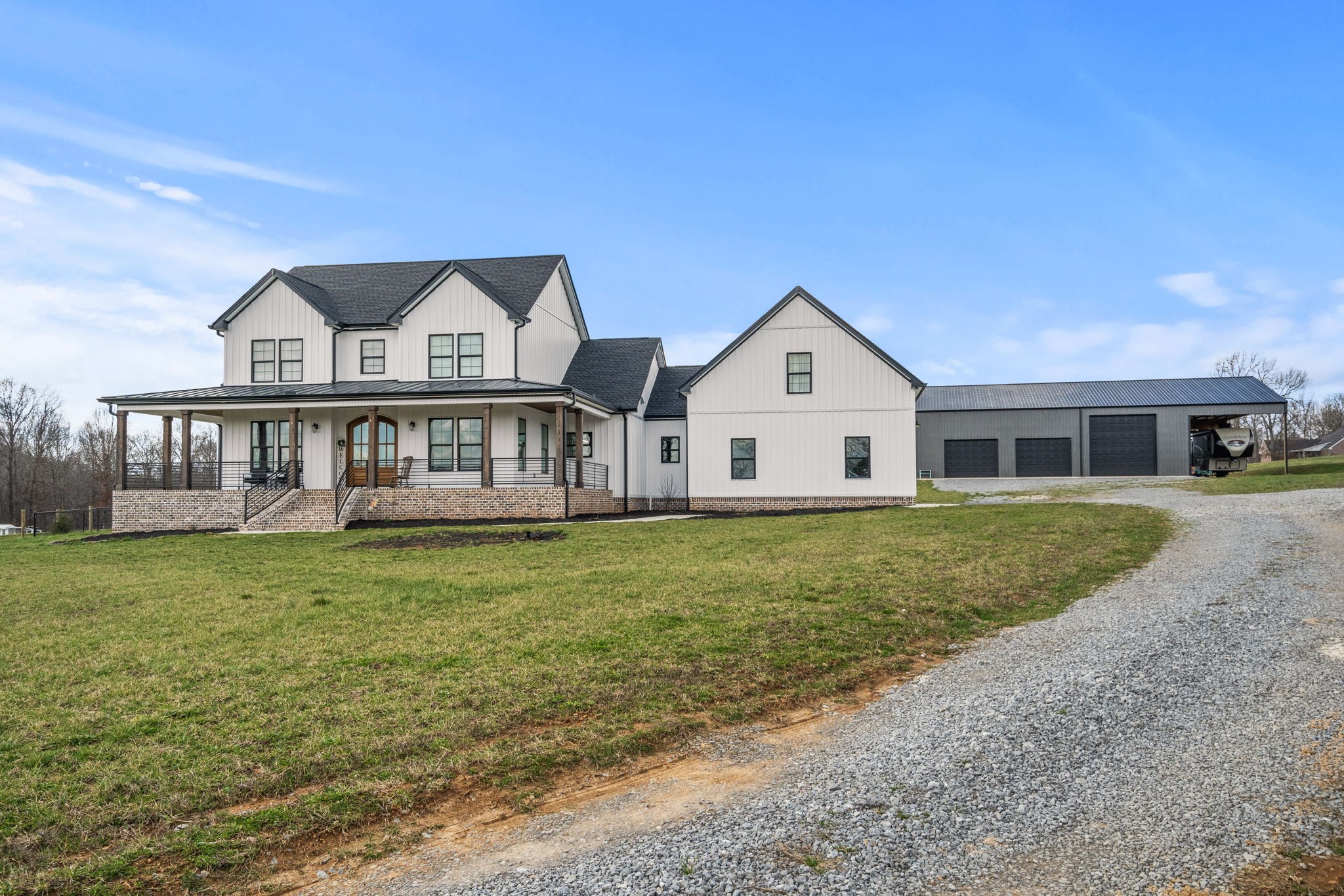 1155 Maxwell Branch Road Cottontown, TN 37048 - Photo 58 of 69 a front view of a house with a garden