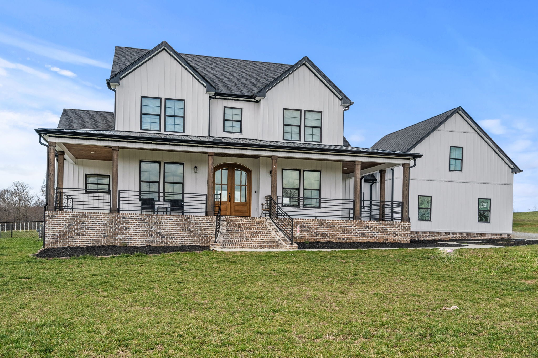 1155 Maxwell Branch Road Cottontown, TN 37048 - Photo 6 of 69 a front view of a house with a yard