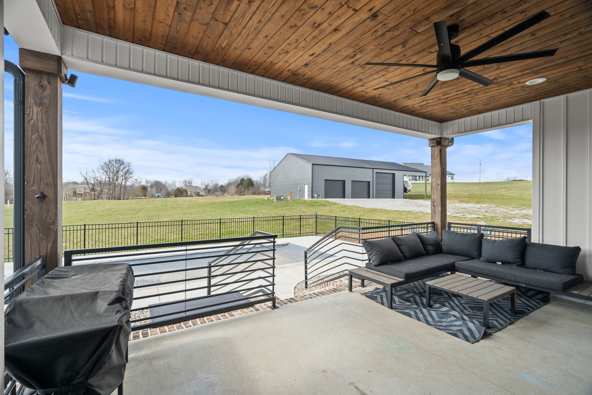 1155 Maxwell Branch Road Cottontown, TN 37048 - Photo 64 of 69 a living room with furniture and a floor to ceiling window