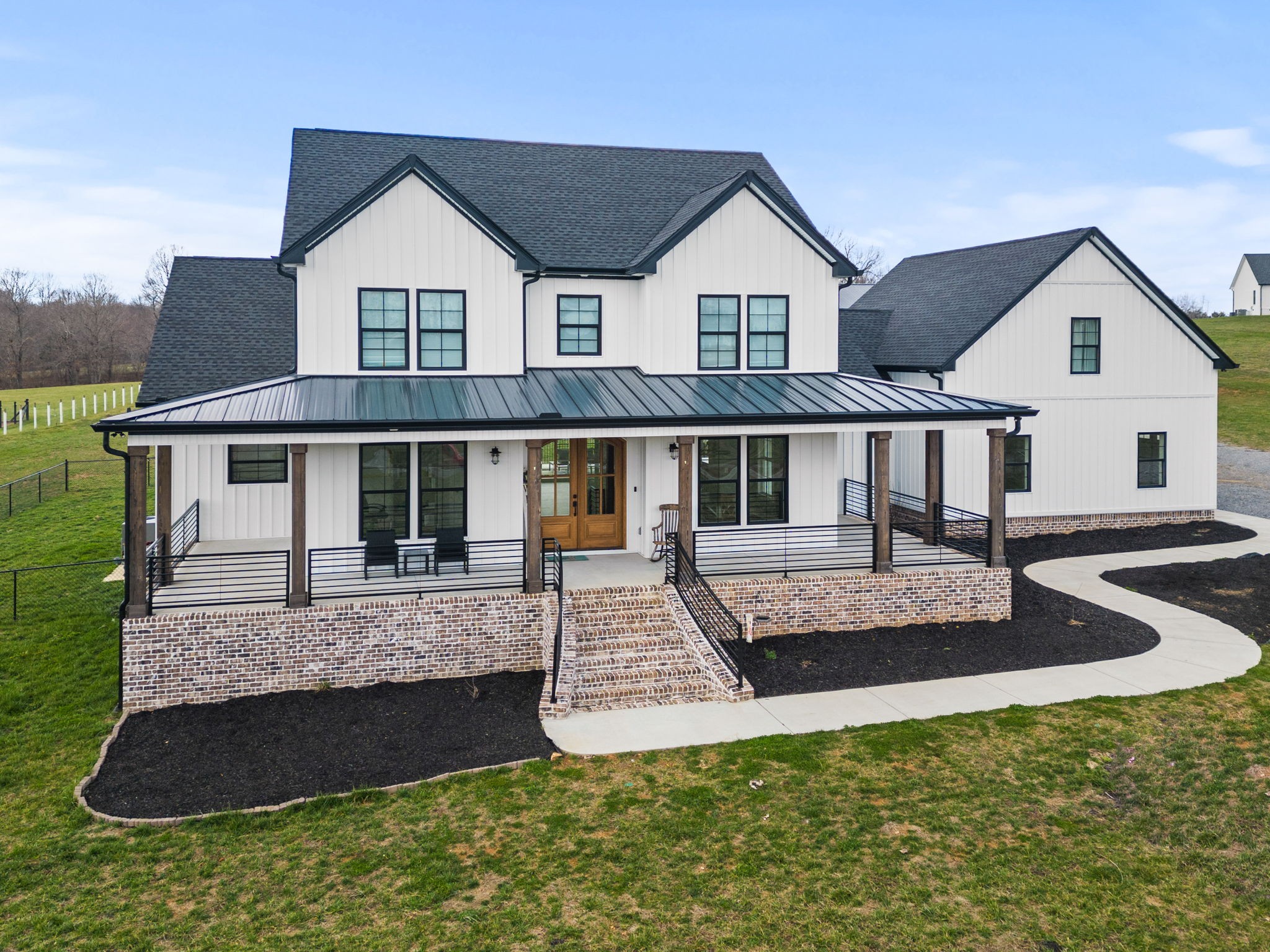 1155 Maxwell Branch Road Cottontown, TN 37048 - Photo 7 of 69 a front view of a house with a yard
