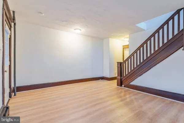a view of an entryway with wooden floor