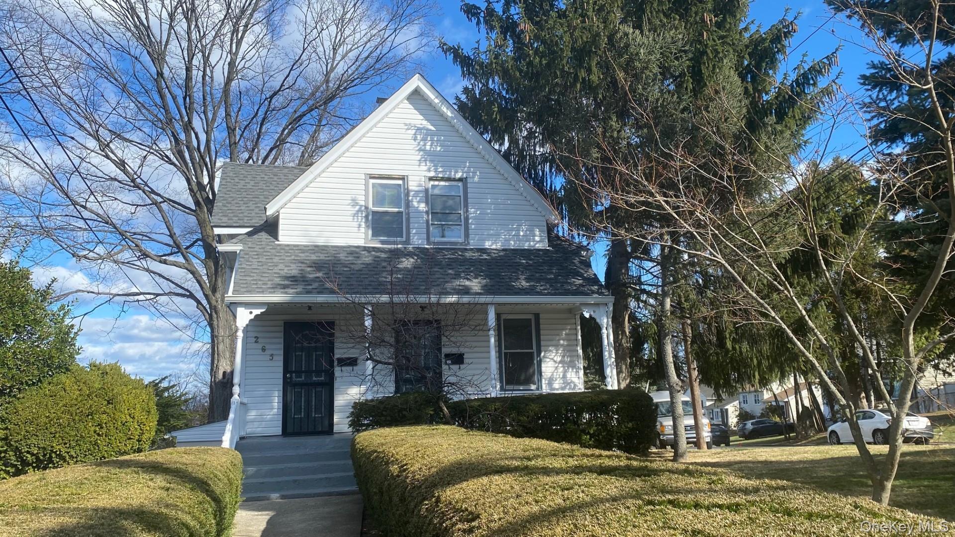 265 Mayflower Avenue, Unit 1 New Rochelle, NY 10801 - Photo 1 of 15 a front view of a house with a yard