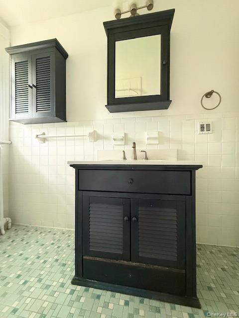 265 Mayflower Avenue, Unit 1 New Rochelle, NY 10801 - Photo 11 of 15 a bathroom with a sink and a mirror