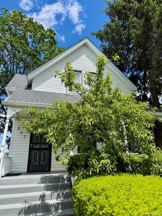265 Mayflower Avenue, Unit 1 New Rochelle, NY 10801 - Photo 13 of 15 a view of a garden with plants and large trees
