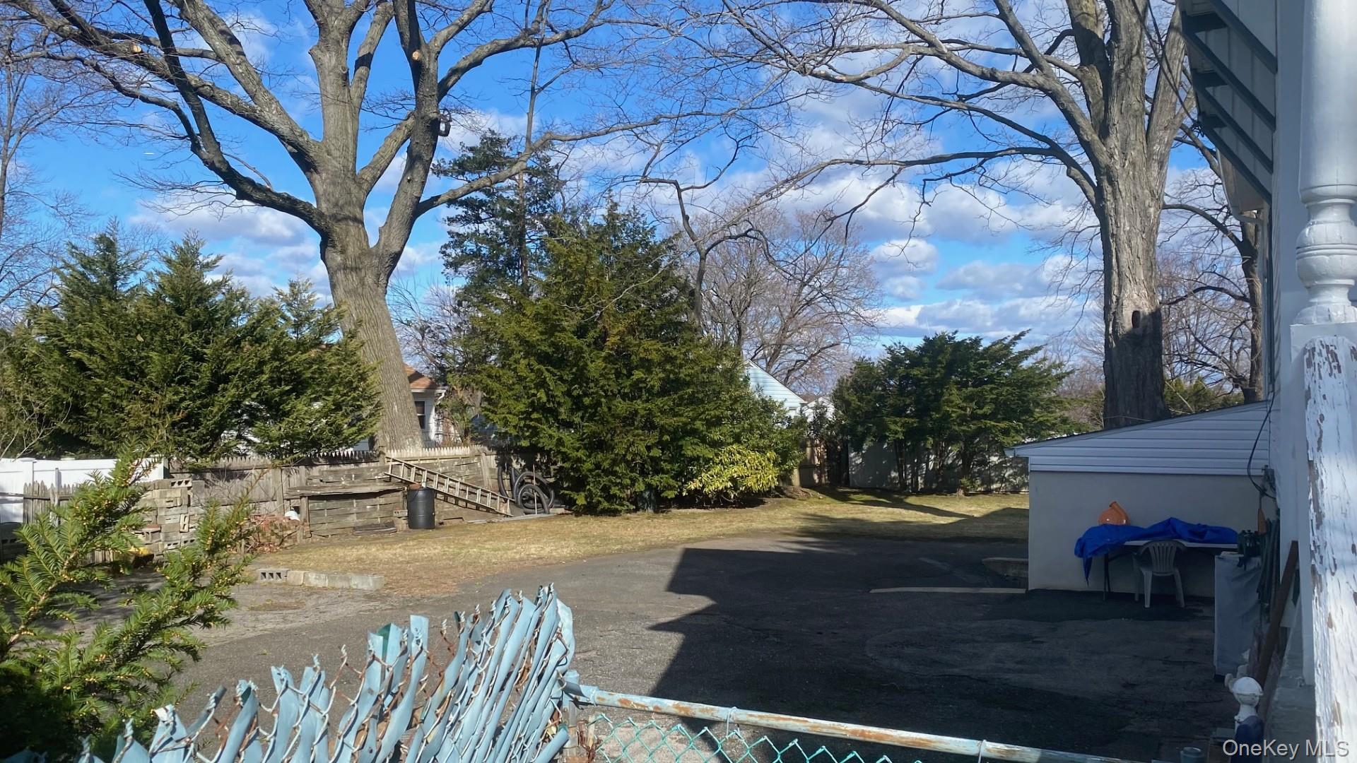 265 Mayflower Avenue, Unit 1 New Rochelle, NY 10801 - Photo 14 of 15 a view of a yard with plants and trees