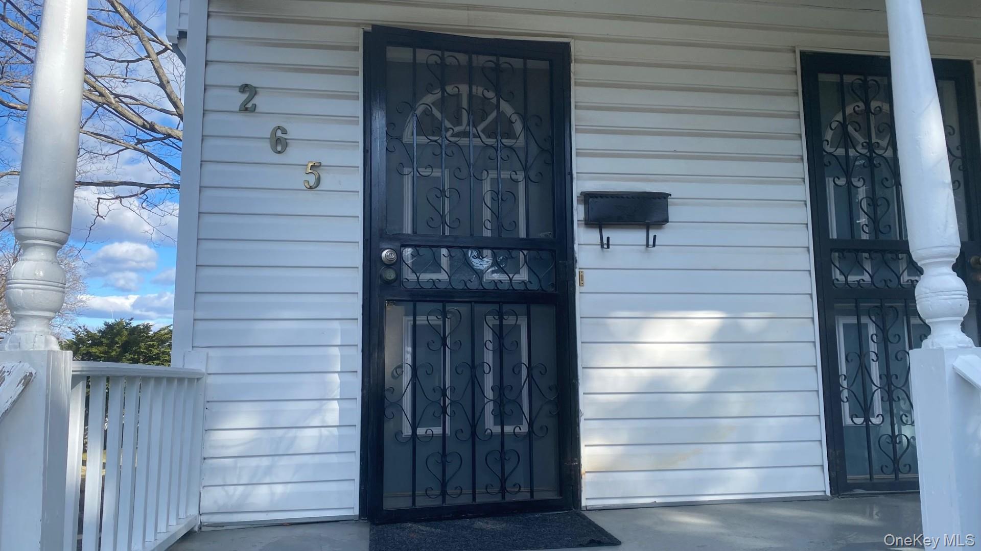 265 Mayflower Avenue, Unit 1 New Rochelle, NY 10801 - Photo 2 of 15 a view of door and wooden door