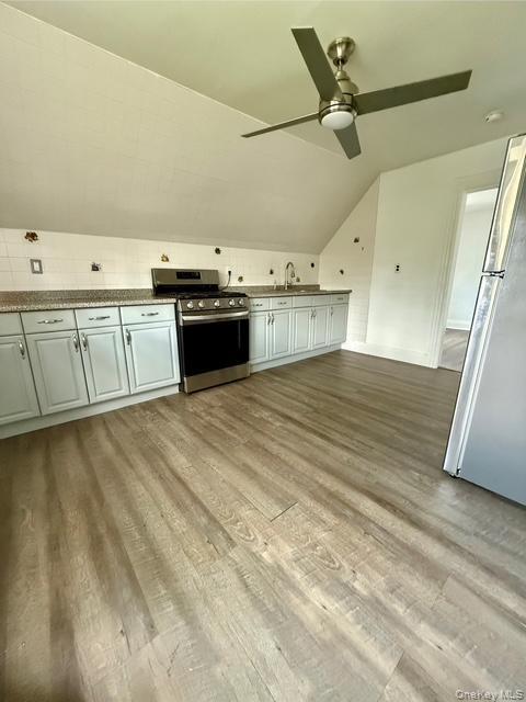 265 Mayflower Avenue, Unit 1 New Rochelle, NY 10801 - Photo 5 of 15 a view of a kitchen with a sink and a stove