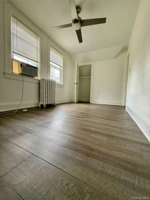 265 Mayflower Avenue, Unit 1 New Rochelle, NY 10801 - Photo 7 of 15 a view of an empty room with a window