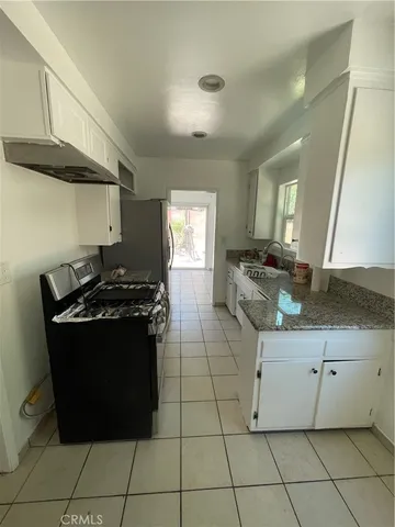 a view of an empty room and wooden floor