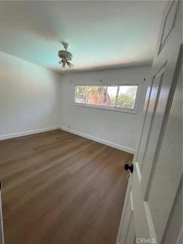 a bathroom with a sink mirror and toilet