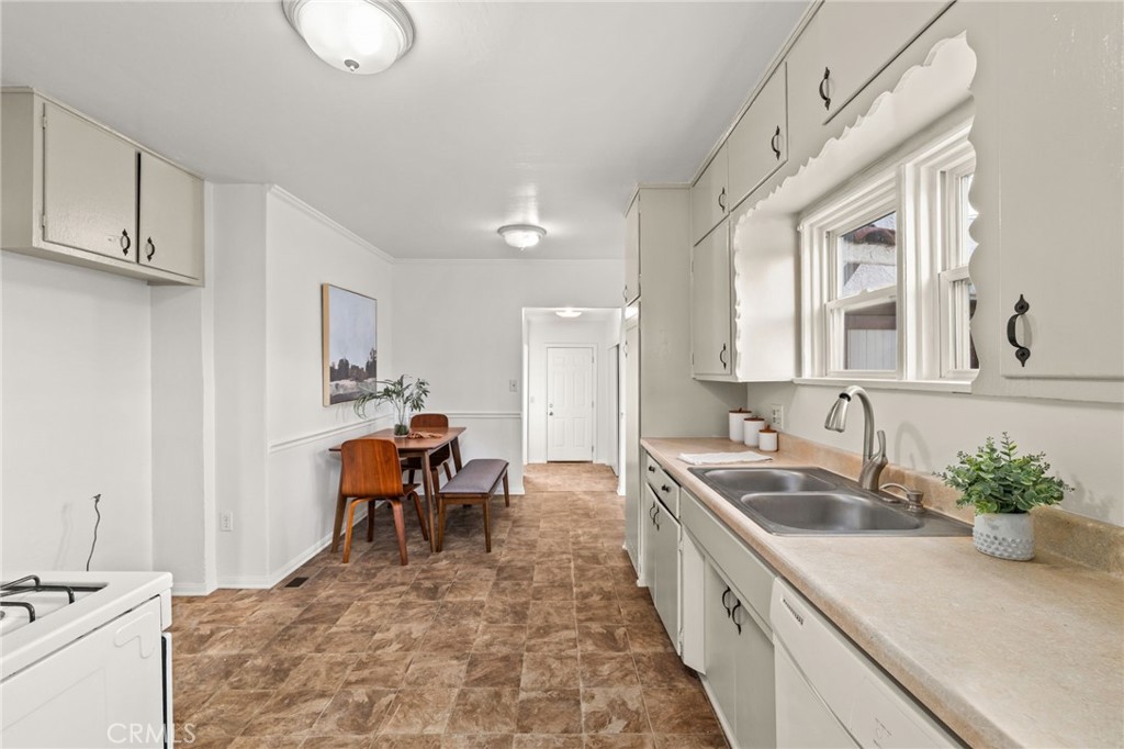 616 Monterey Street Redlands, CA 92373 - Photo 11 of 20 a kitchen with a sink and cabinets