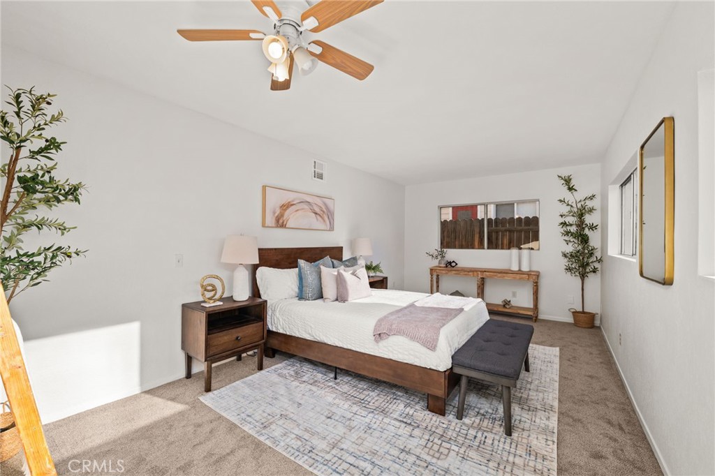 616 Monterey Street Redlands, CA 92373 - Photo 17 of 20 a bedroom with a bed and a night stand