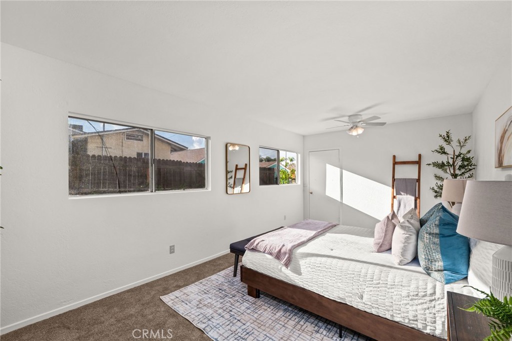616 Monterey Street Redlands, CA 92373 - Photo 18 of 20 a bedroom with a large bed and a window
