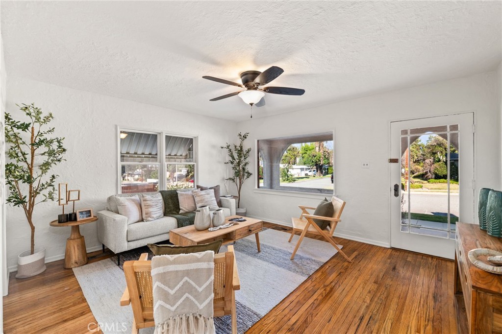 616 Monterey Street Redlands, CA 92373 - Photo 4 of 20 a living room with furniture and a wooden floor