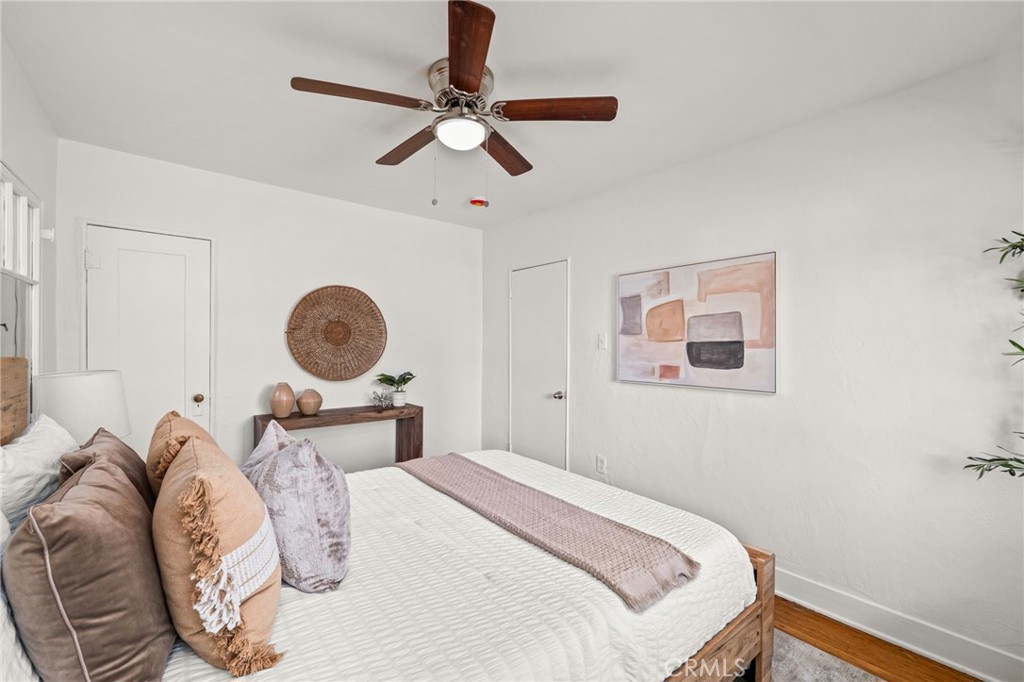 616 Monterey Street Redlands, CA 92373 - Photo 6 of 20 a bedroom with a bed and a chandelier