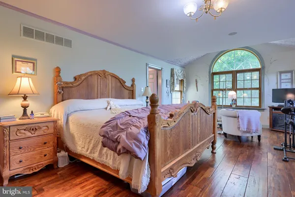 a bed room with a bed and a dresser