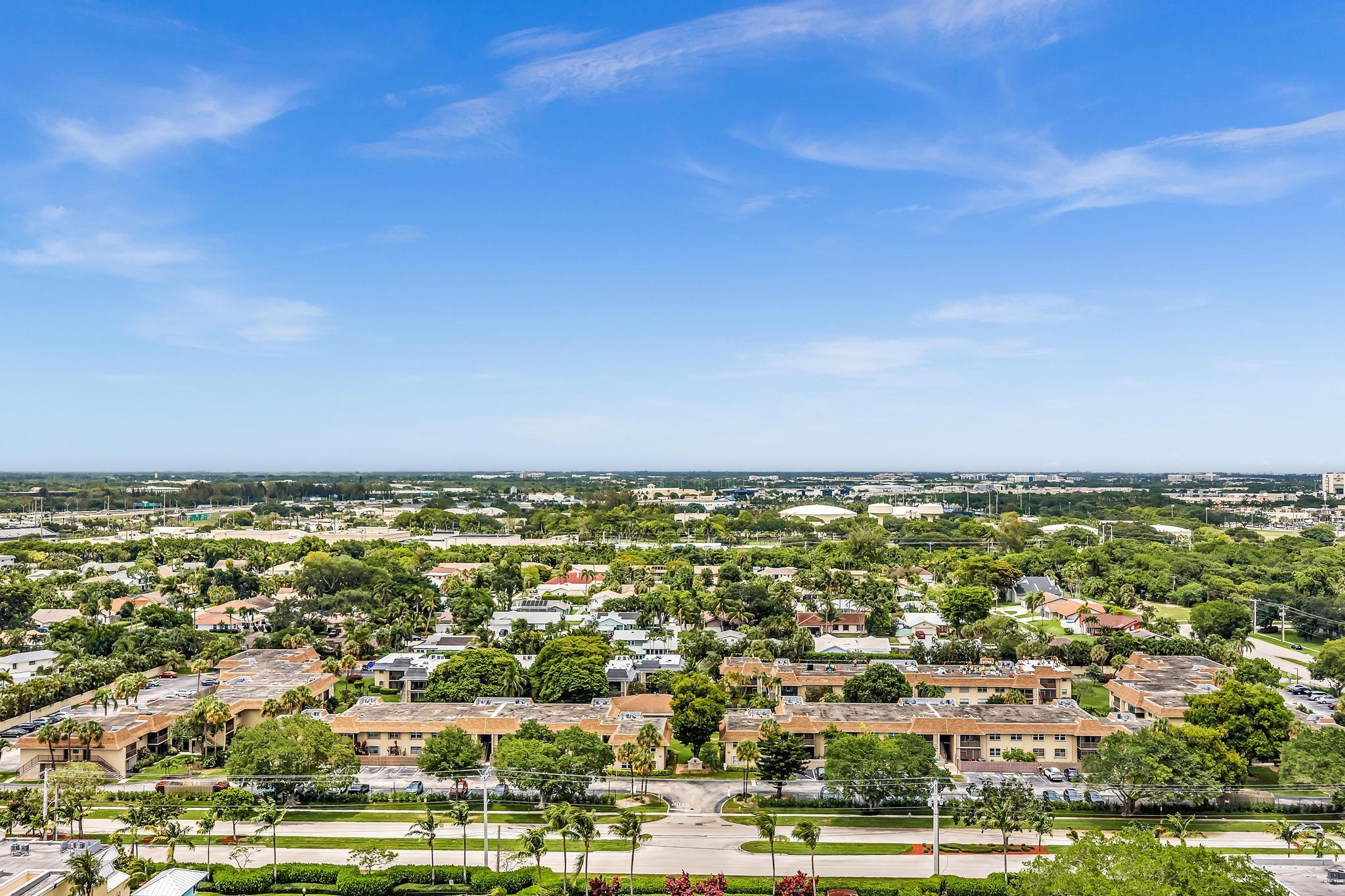 1291 Northwest 13th Street, Unit 445D Boca Raton, FL 33486 - Photo 46 of 50 an aerial view of residential building and ocean