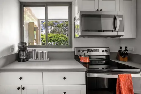 a kitchen with a stove and a microwave