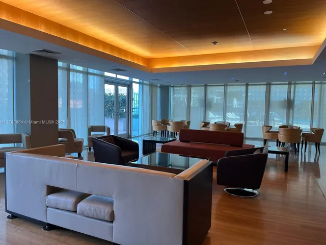 a view of a patio with table and chairs