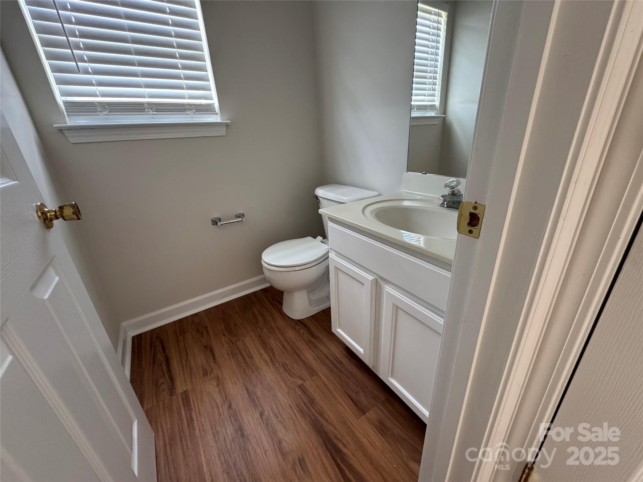 5506 Rogers Road Indian Trail, NC 28079 - Photo 17 of 30 a bathroom with a sink and toilet with window