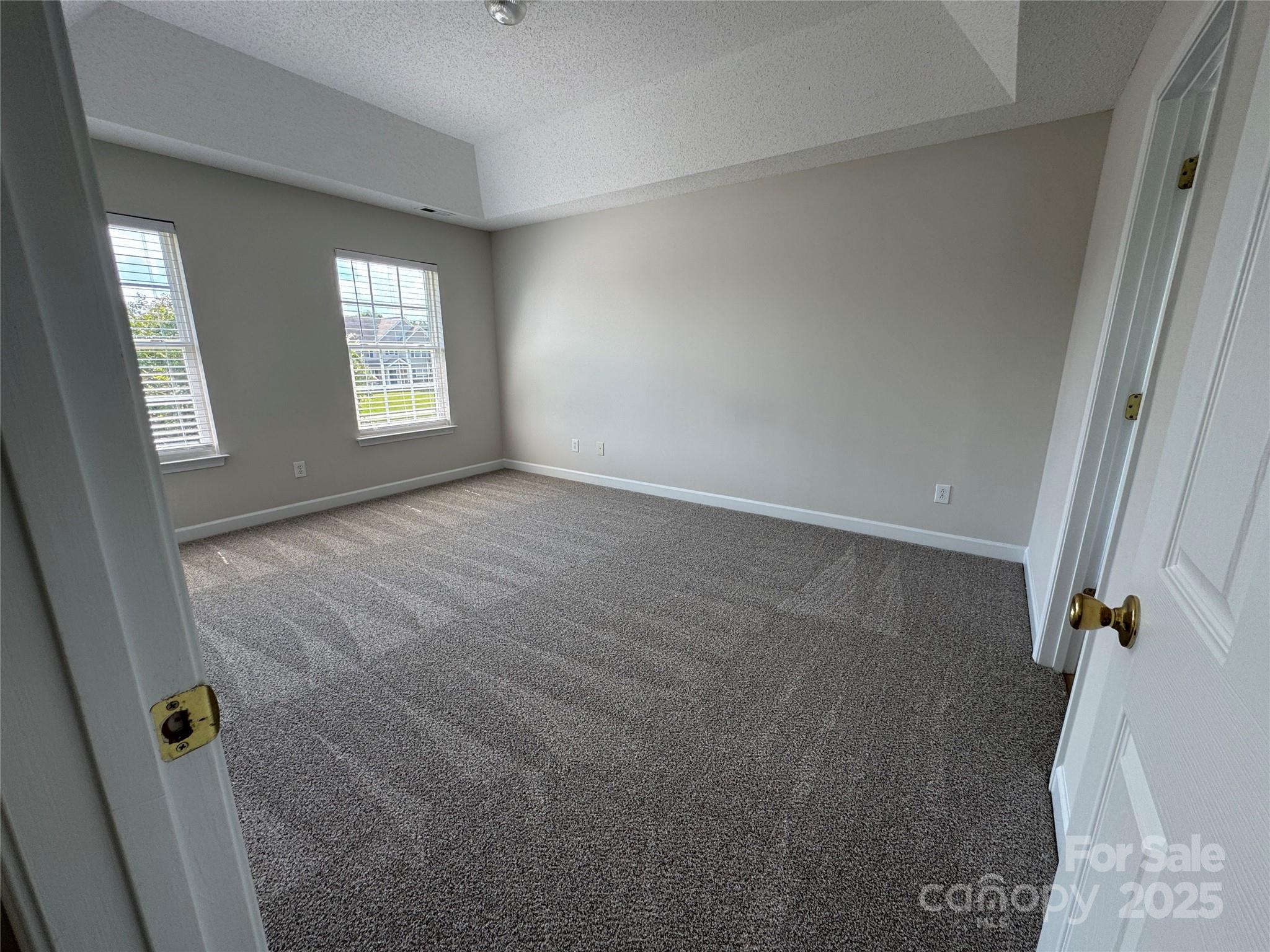 5506 Rogers Road Indian Trail, NC 28079 - Photo 19 of 30 an empty room with windows