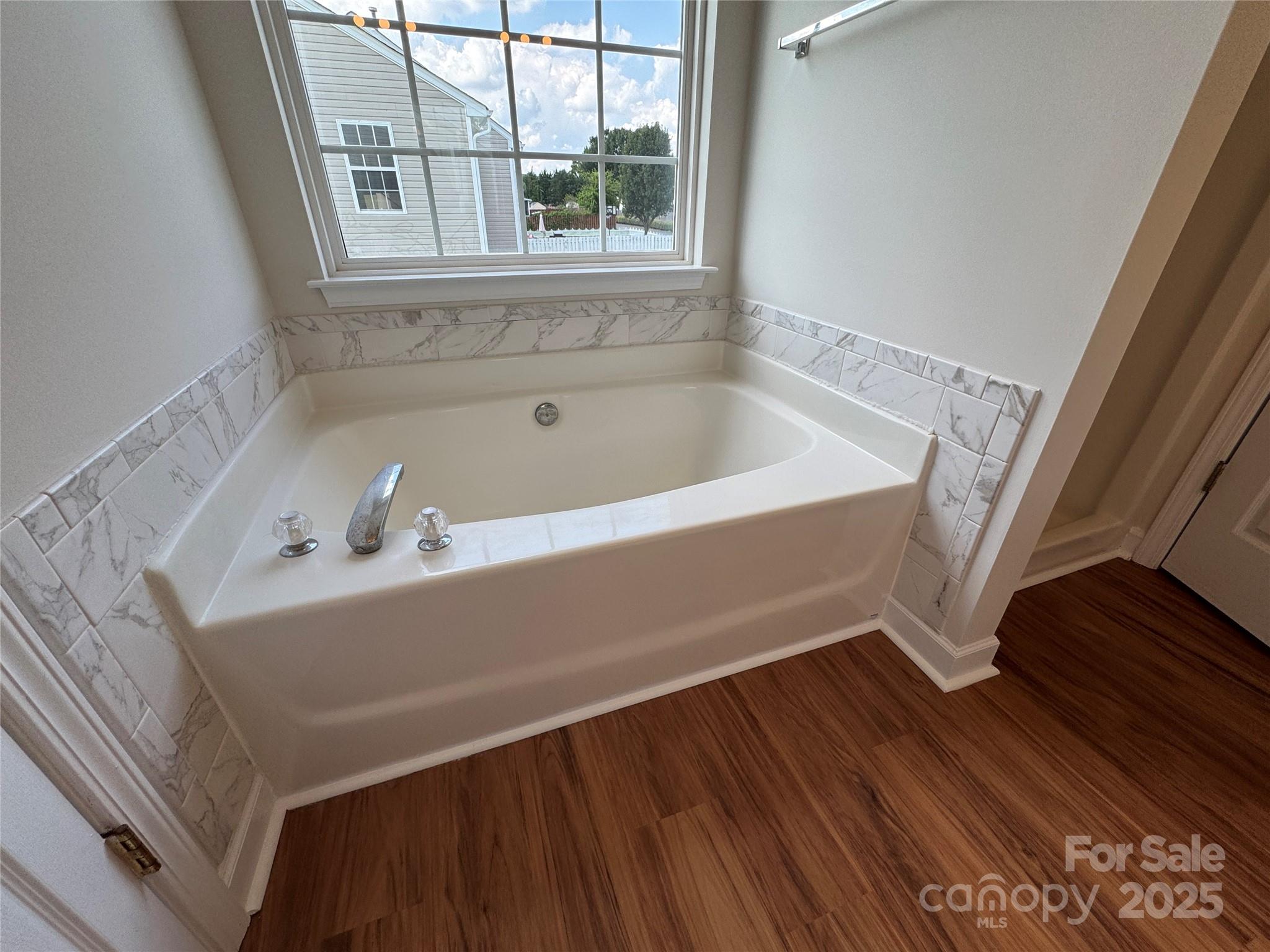 5506 Rogers Road Indian Trail, NC 28079 - Photo 22 of 30 a bathroom with a sink and a bathtub