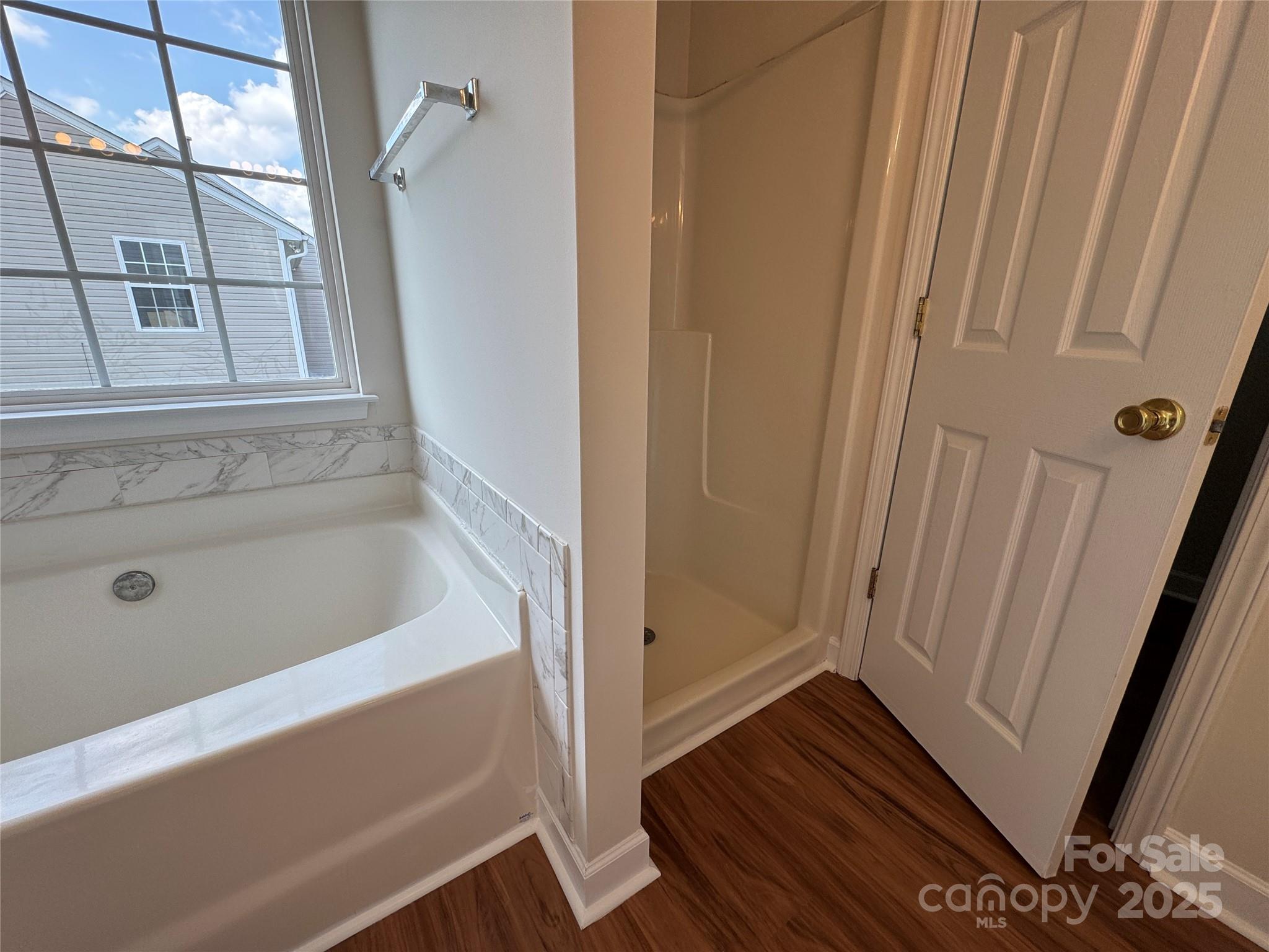 5506 Rogers Road Indian Trail, NC 28079 - Photo 23 of 30 a bathroom with a bathtub