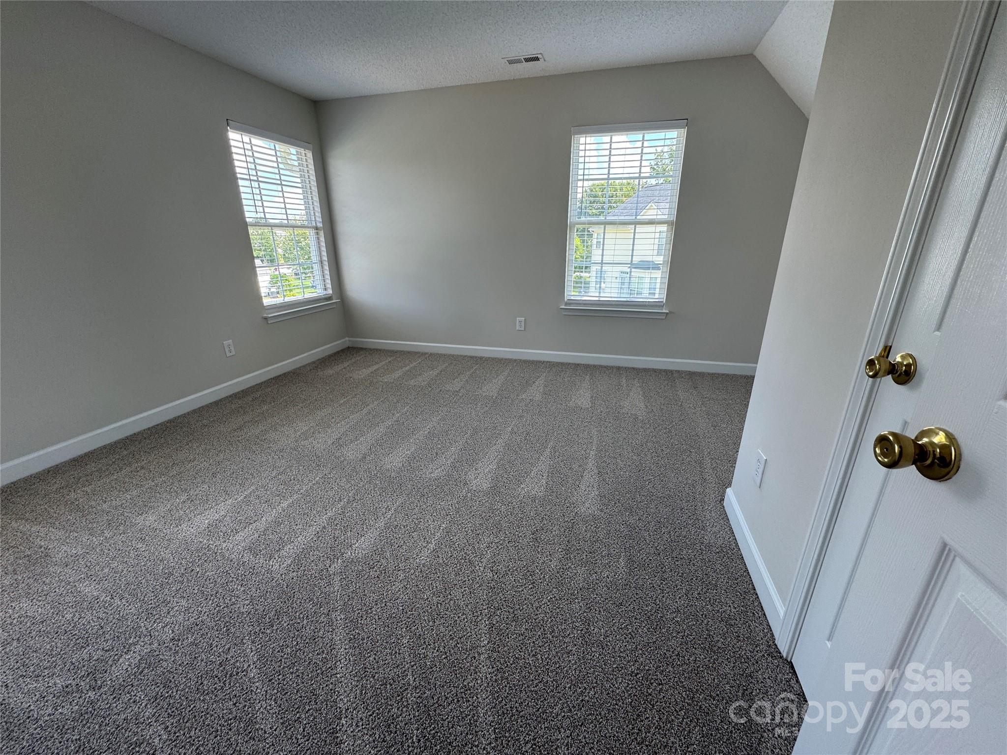 5506 Rogers Road Indian Trail, NC 28079 - Photo 26 of 30 an empty room with windows