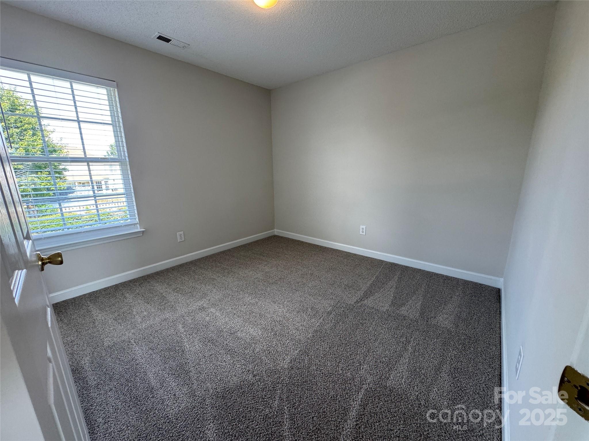 5506 Rogers Road Indian Trail, NC 28079 - Photo 27 of 30 an empty room with a window
