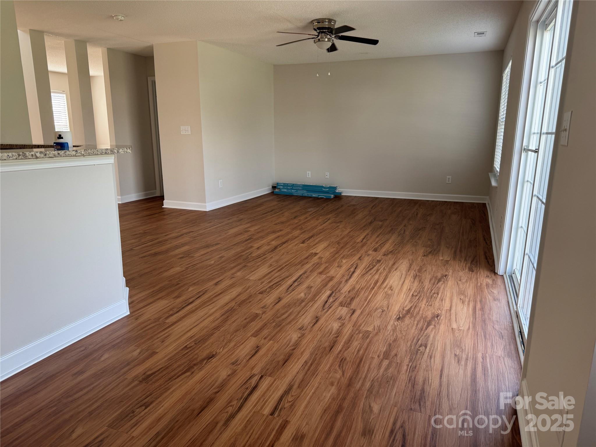 5506 Rogers Road Indian Trail, NC 28079 - Photo 9 of 30 wooden floor in an empty room with a window