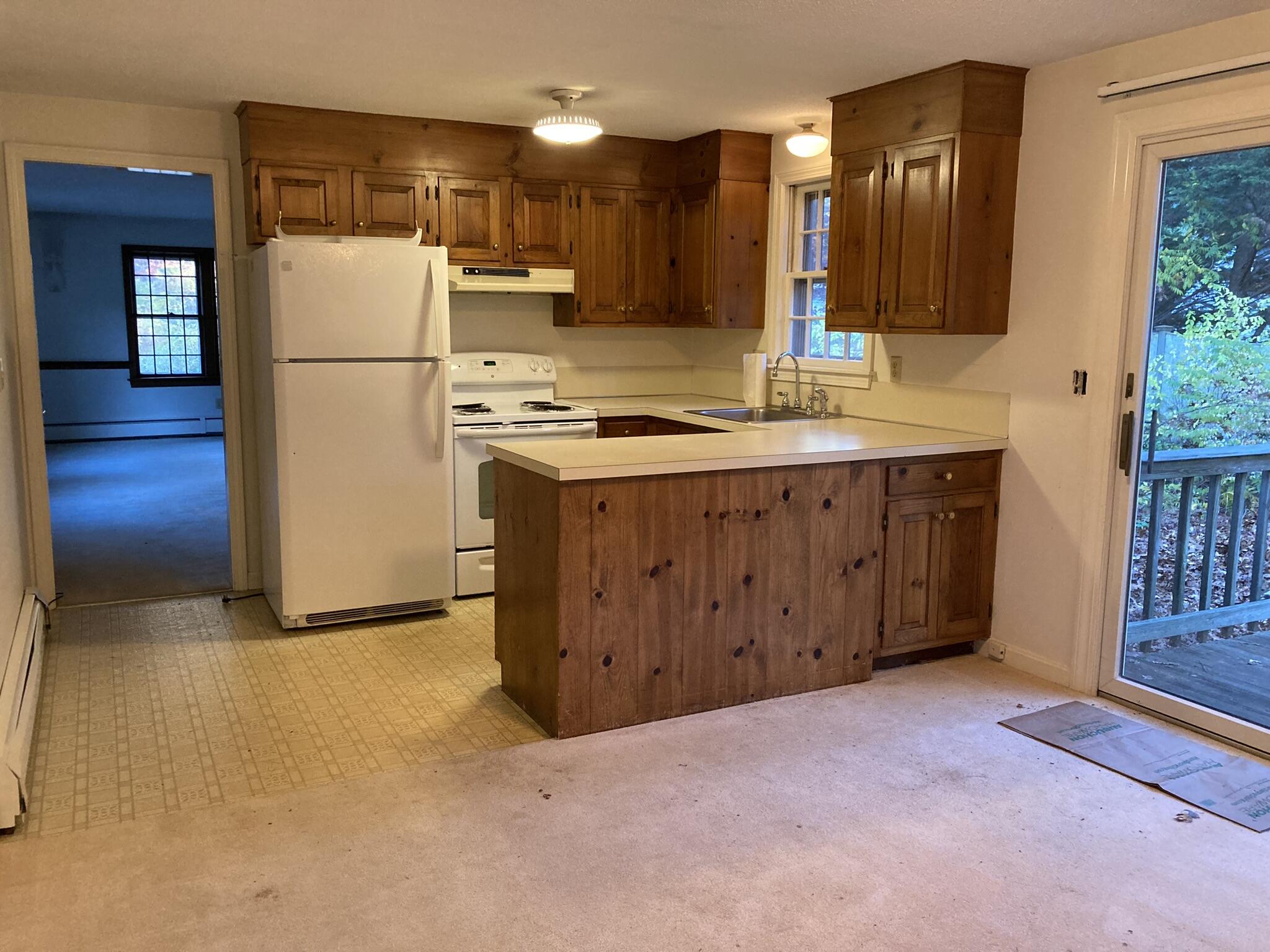 426 Nottingham Drive Centerville, MA 02632 - Photo 11 of 25 a kitchen with a refrigerator sink and cabinets