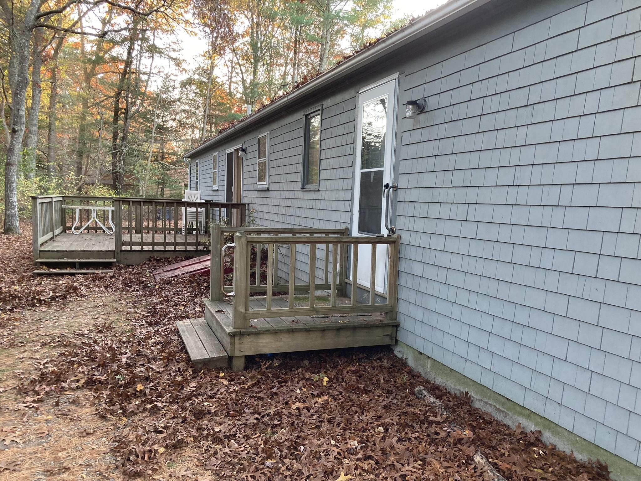 426 Nottingham Drive Centerville, MA 02632 - Photo 22 of 25 a view of a house with a yard