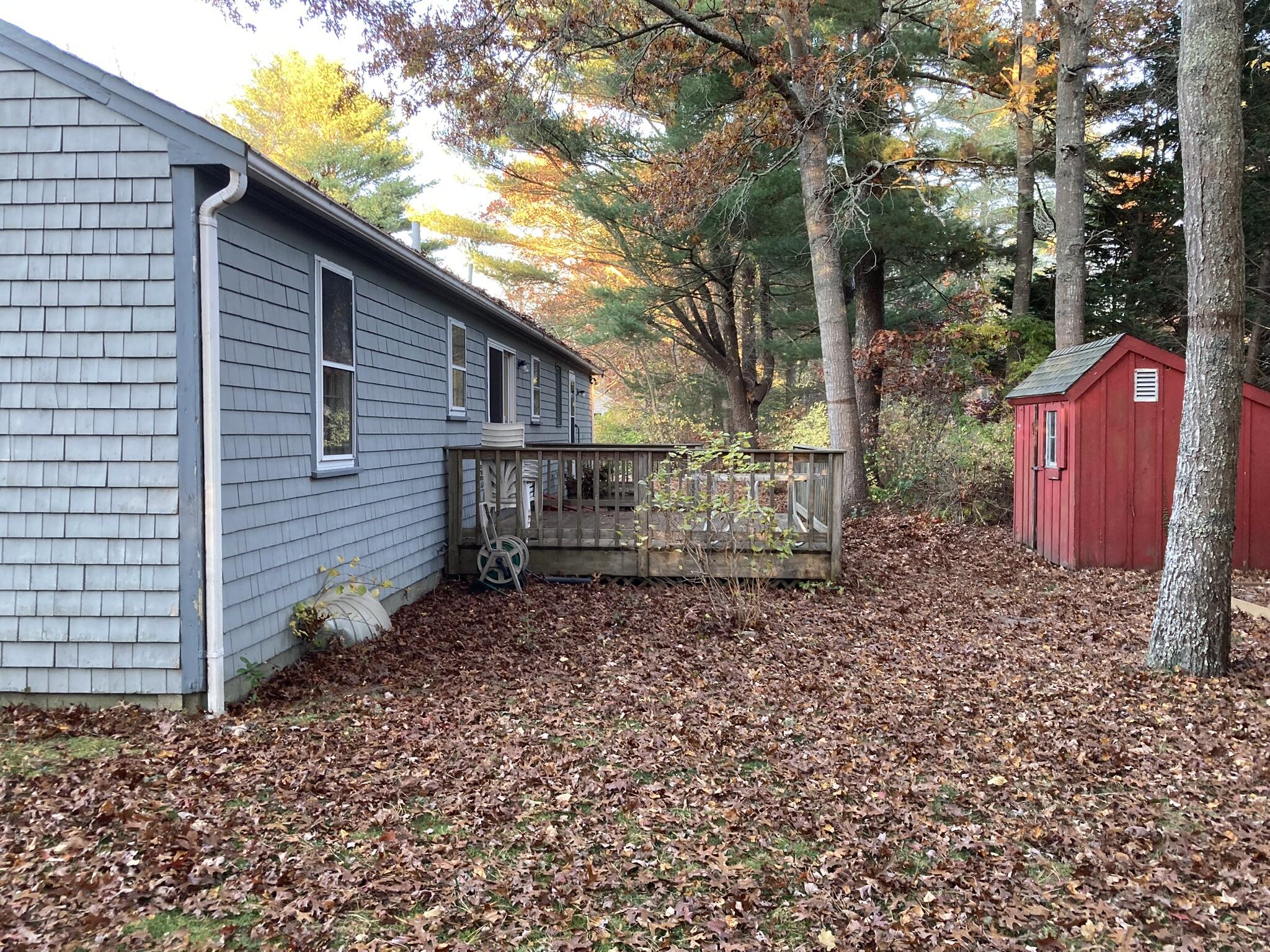 426 Nottingham Drive Centerville, MA 02632 - Photo 24 of 25 a backyard of a house with lots of green space