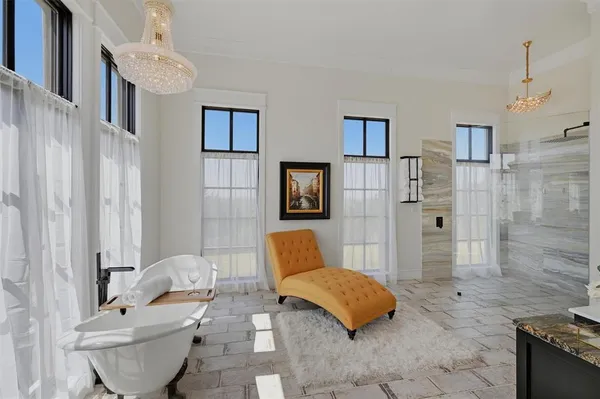 a view of balcony with furniture and wooden floor