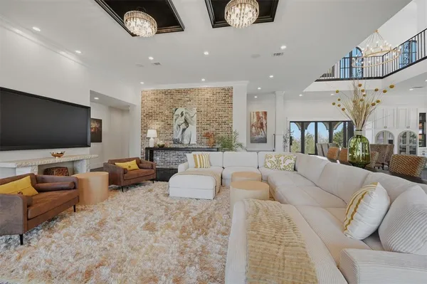 a kitchen with stainless steel appliances kitchen island granite countertop a stove a sink and a refrigerator