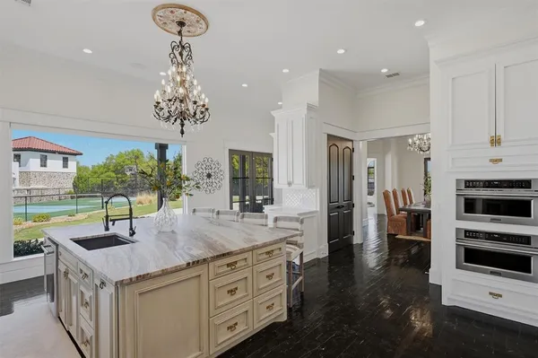 a very nice looking room with a large window and furniture