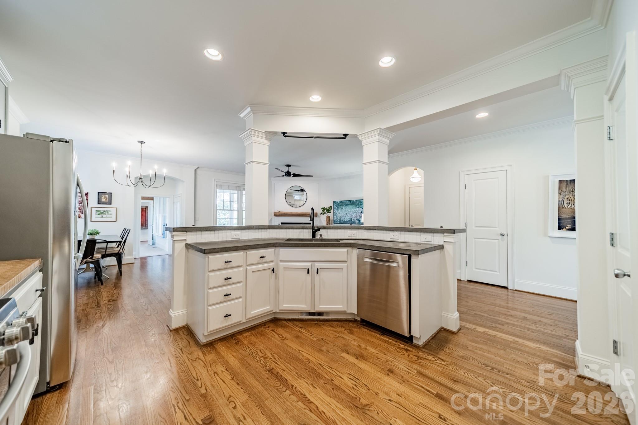 3264 Richard's Crossing Fort Mill, SC 29708 - Photo 20 of 48 a kitchen with granite countertop white cabinets and stainless steel appliances