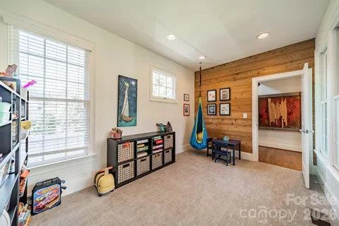 a view of a livingroom with furniture and windows