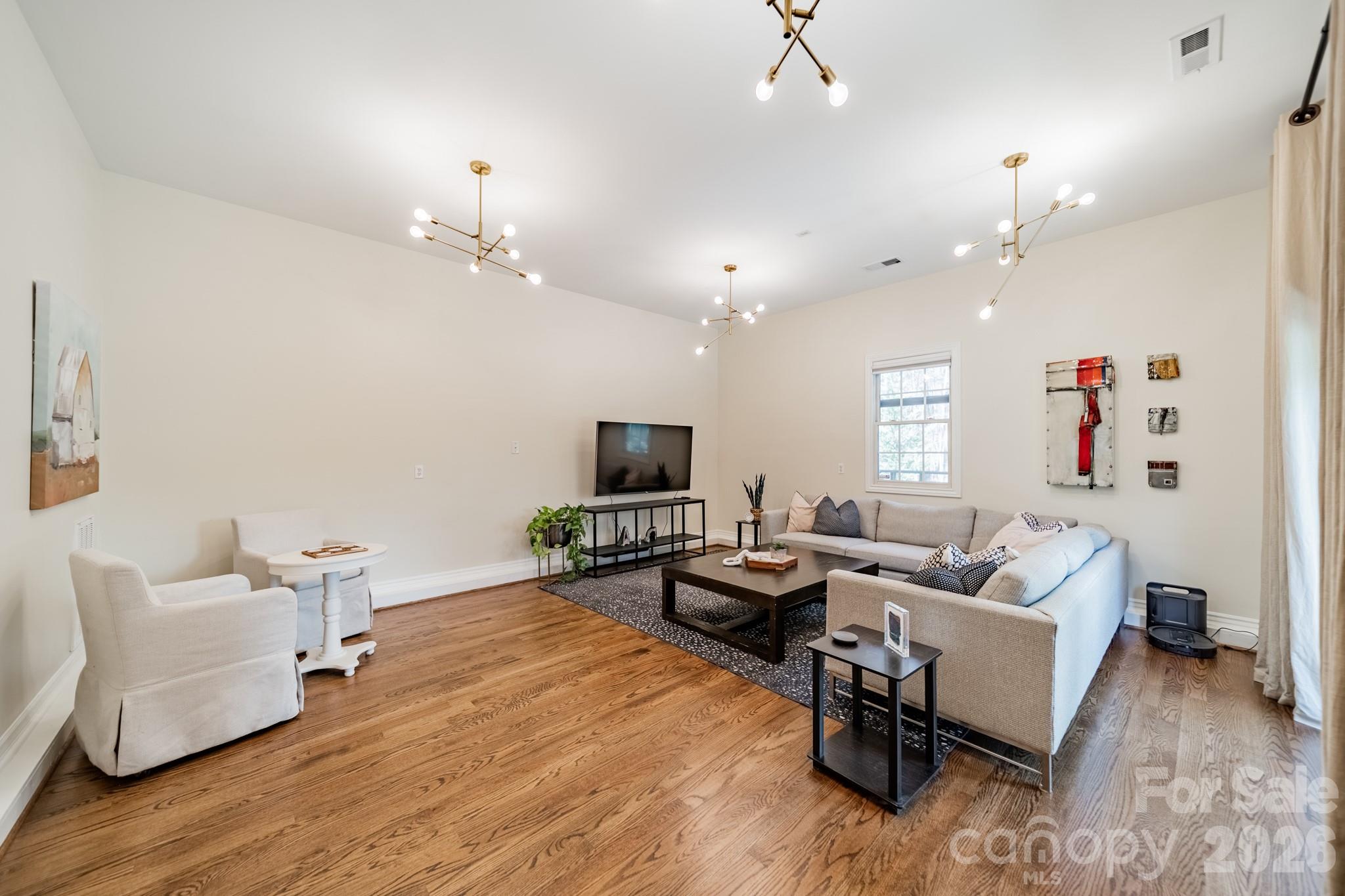 3264 Richard's Crossing Fort Mill, SC 29708 - Photo 24 of 48 a living room with furniture and a flat screen tv