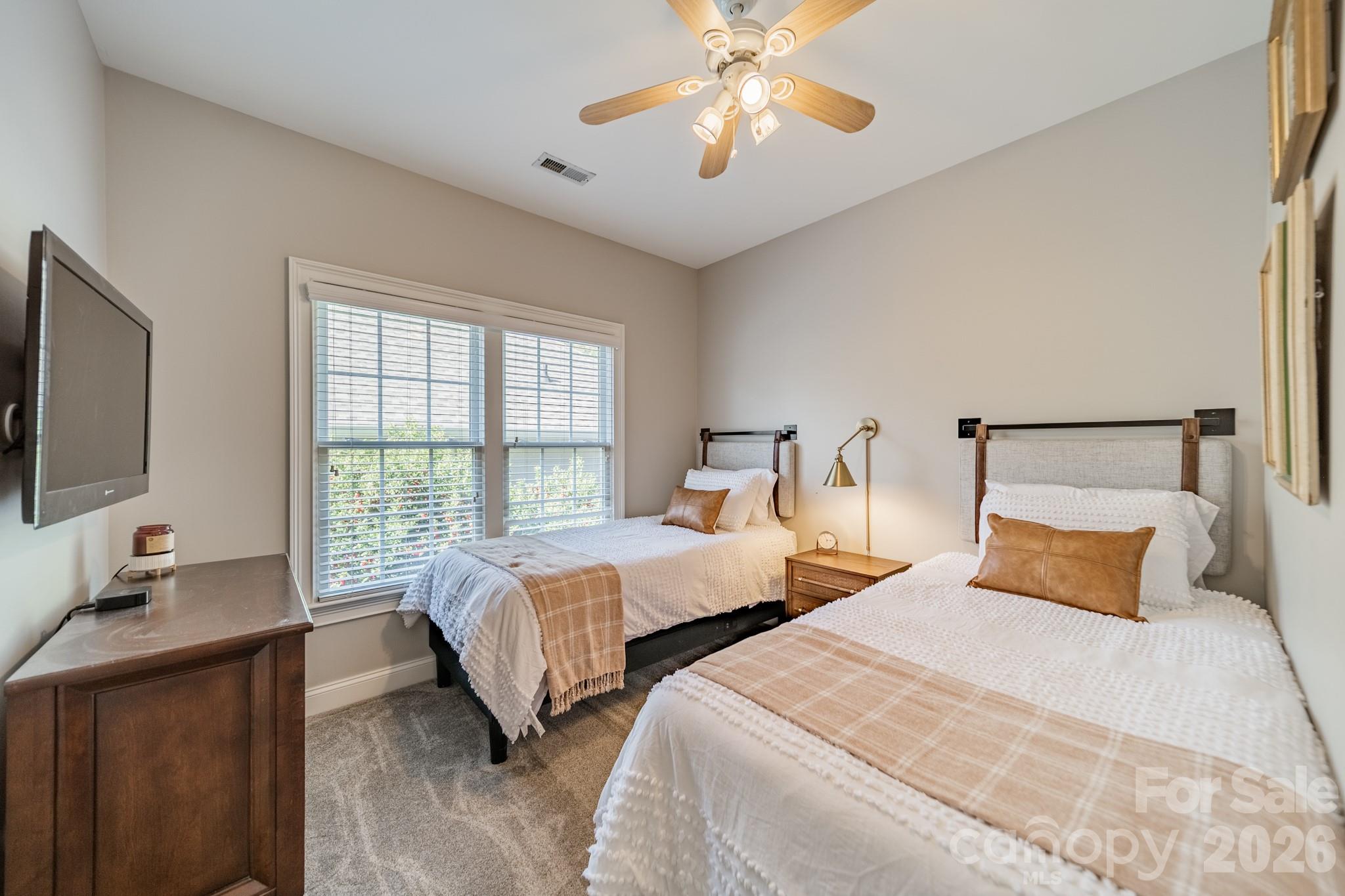3264 Richard's Crossing Fort Mill, SC 29708 - Photo 31 of 48 a bedroom with two beds and a chandelier