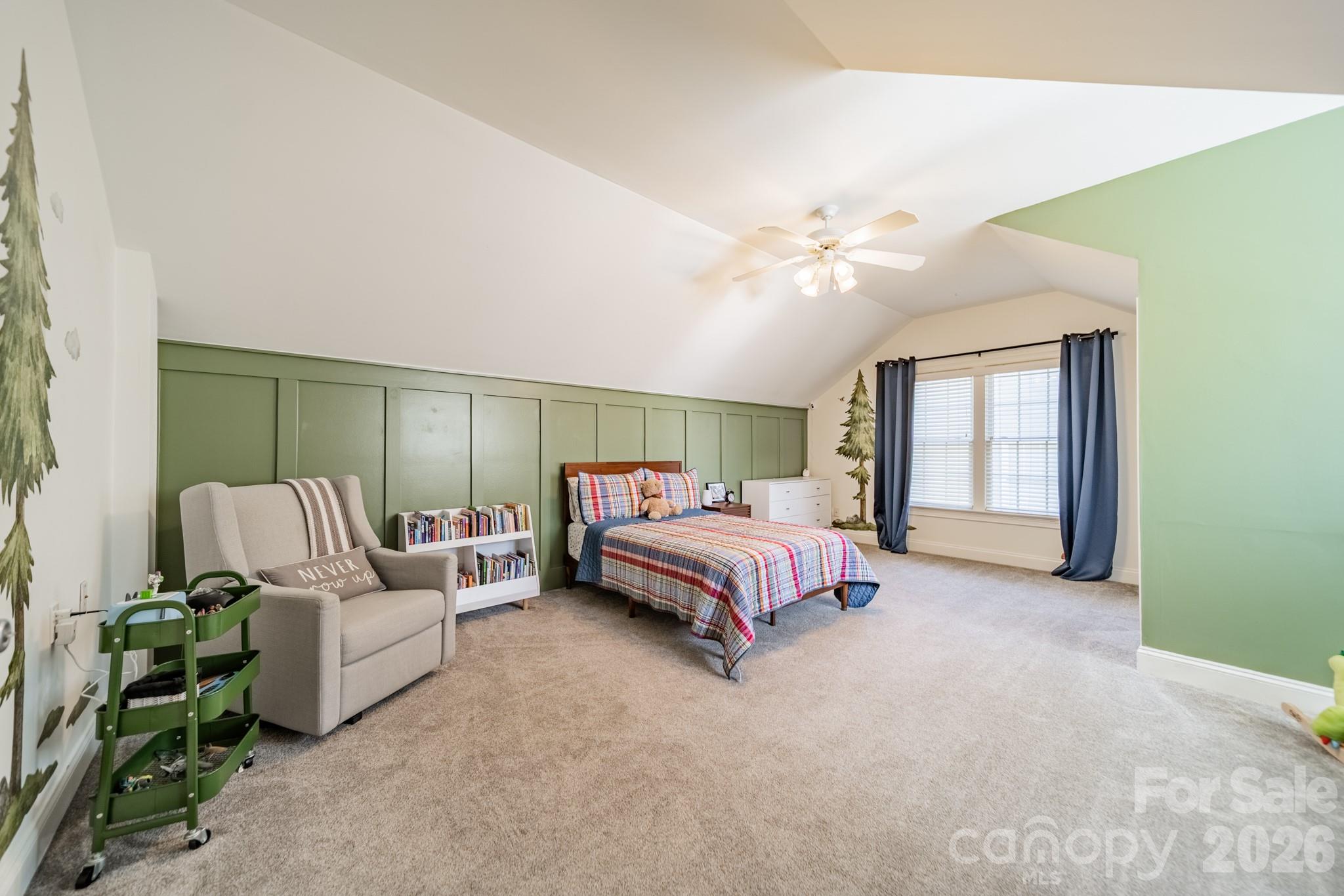 3264 Richard's Crossing Fort Mill, SC 29708 - Photo 32 of 48 a spacious bedroom with a bed and a chandelier