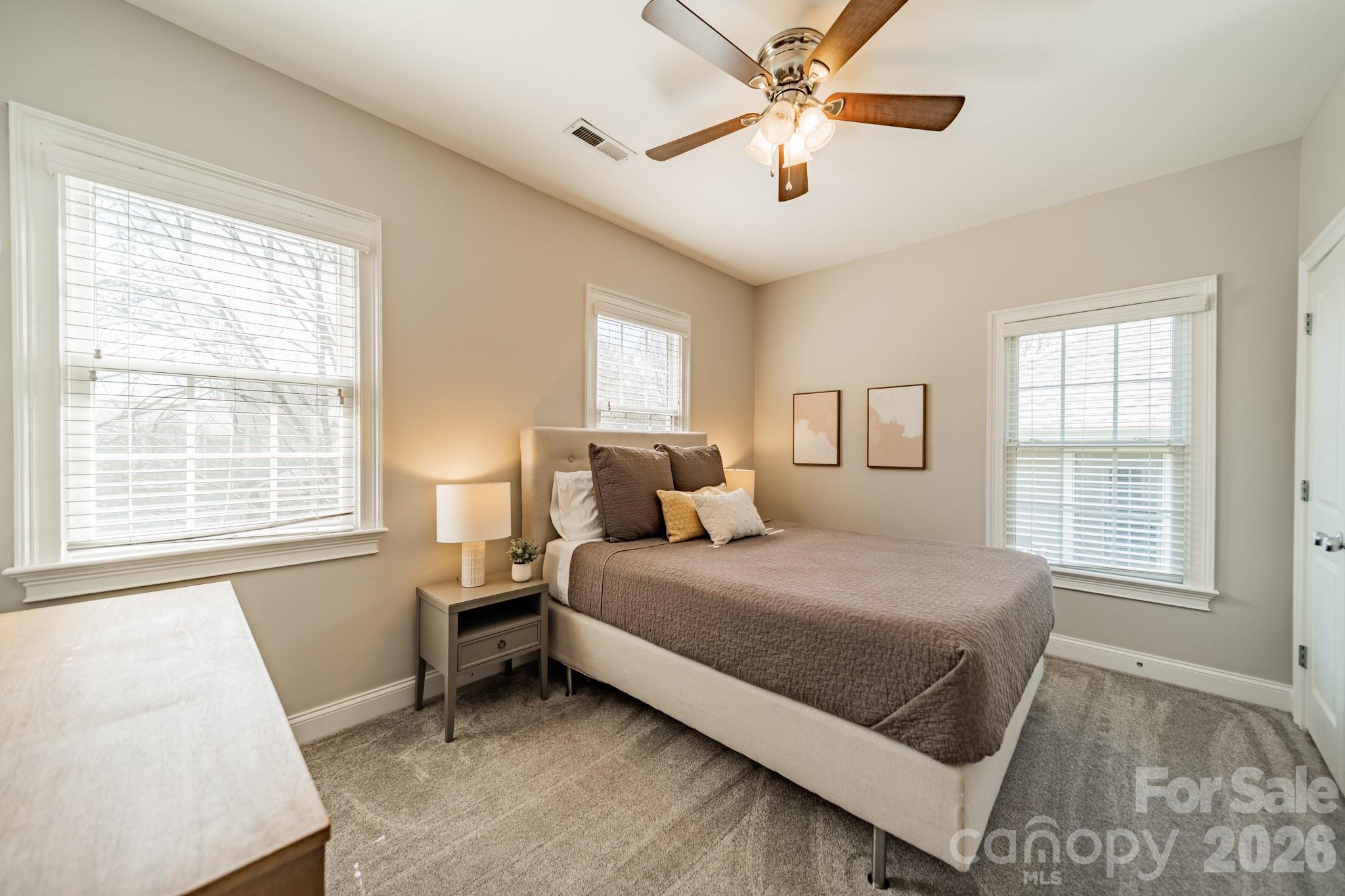 3264 Richard's Crossing Fort Mill, SC 29708 - Photo 35 of 48 a bedroom with a large bed and a window
